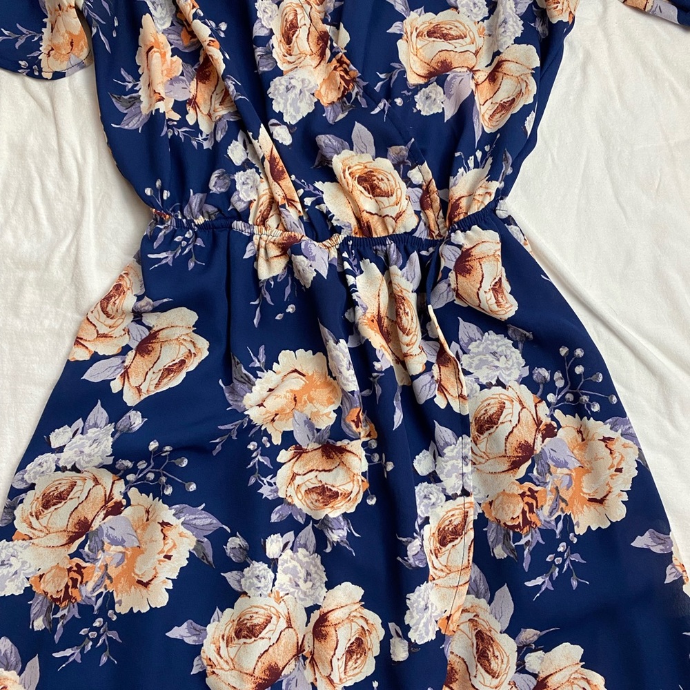 Beautiful flower dress.  Like new it’s a short length, medium size